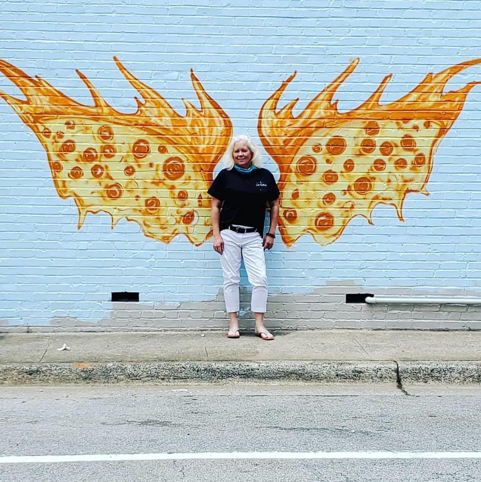 Person in front of wings