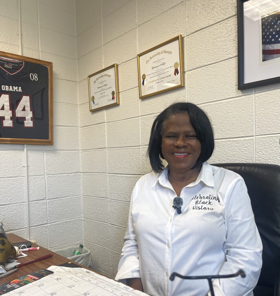 Ms. Rosemary Walker sitting at her desk 