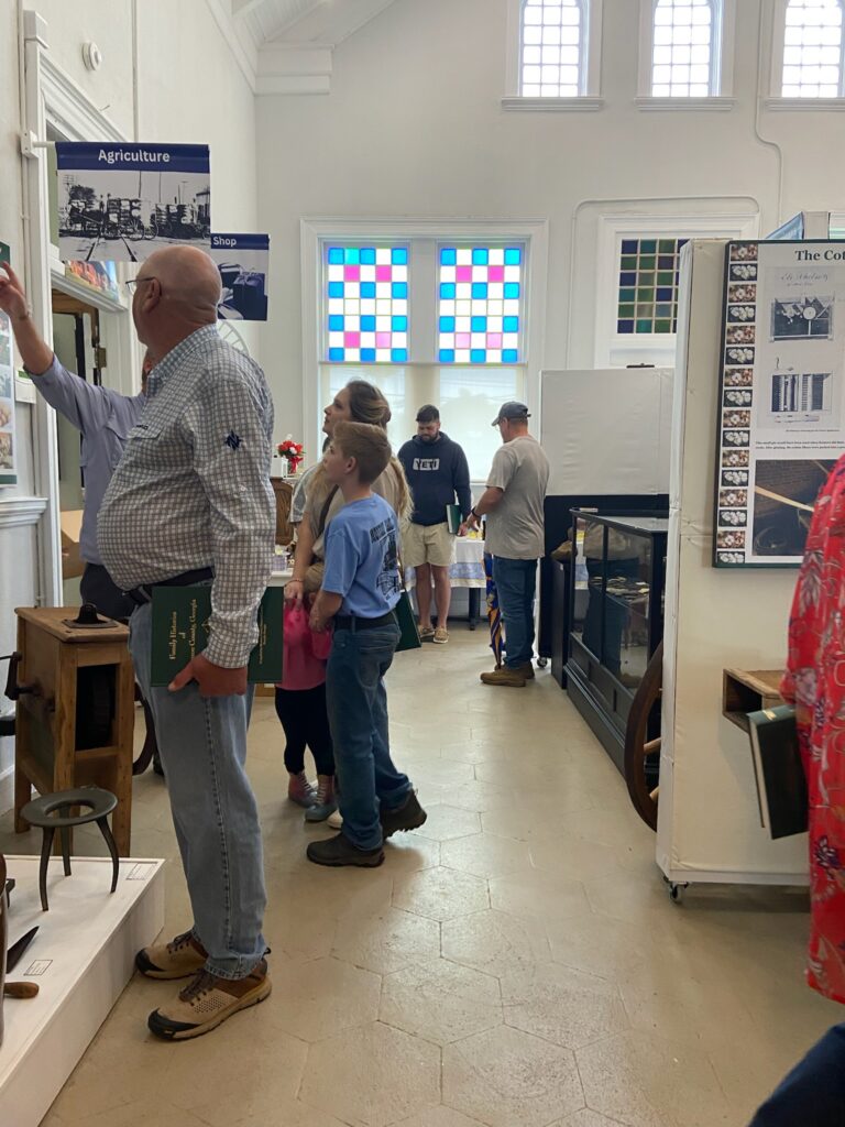 Group of people looking at the exhibit.