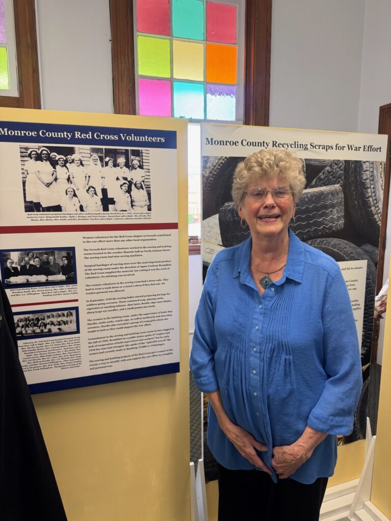 Picture of Taylor Durden next to new exhibit.