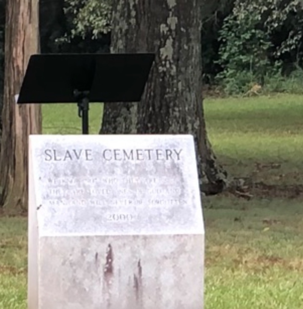 A picture of a marker at the Slave Cemetery in Culloden