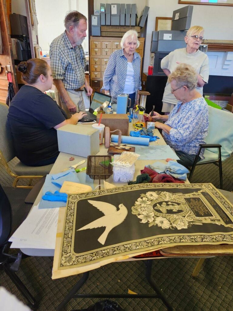 Group of volunteers working on the new exhibits at MCHS.