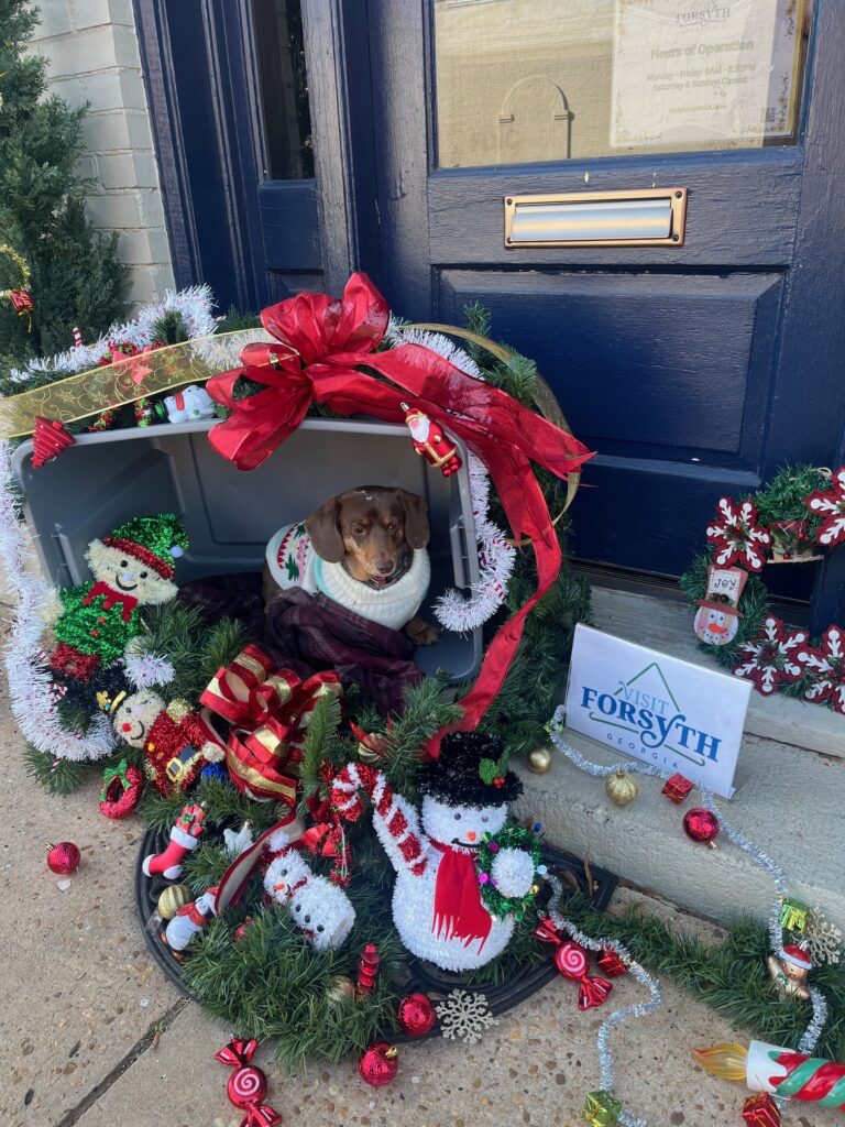 Cocopuff in front of CVB office