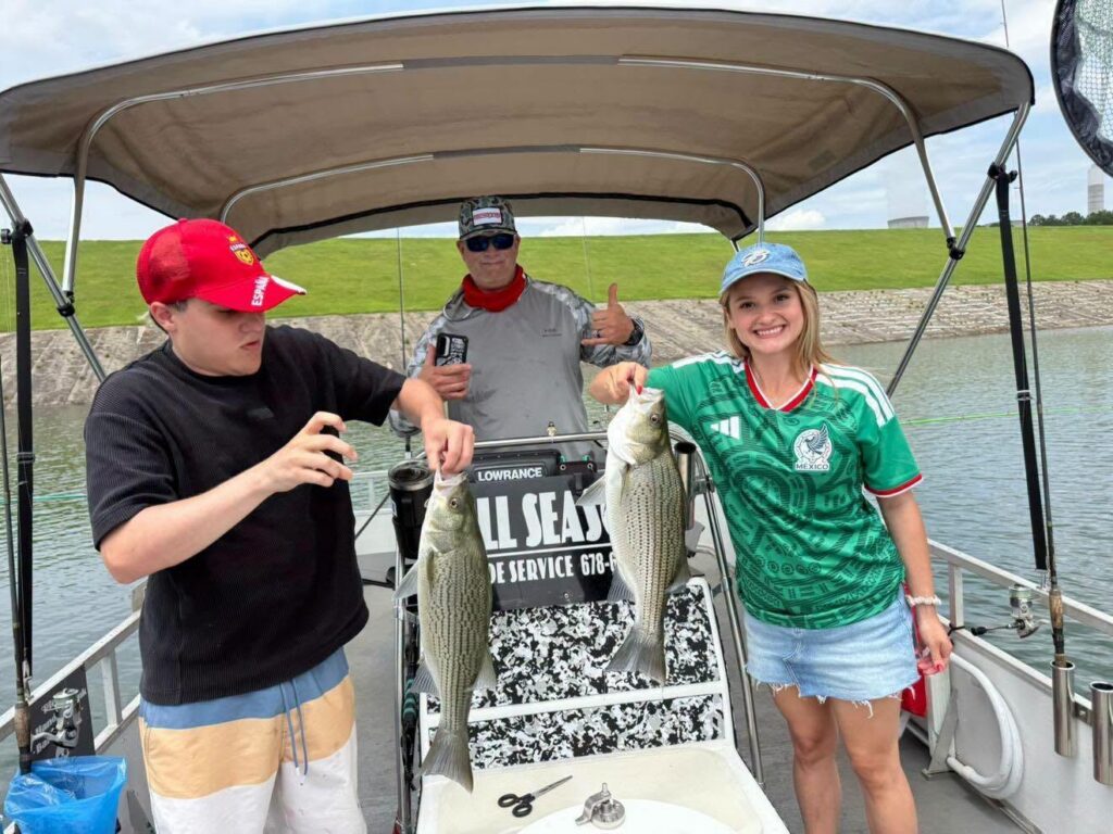 World Cup fans from Puerto Rico go fishing on Lake Juliette